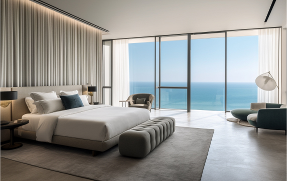 A bedroom with floor-to-ceiling sea views